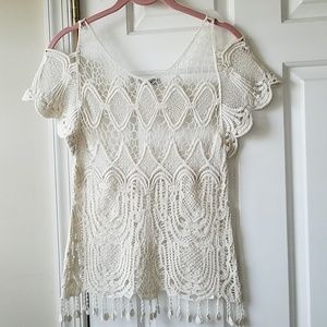 Exquisite macrame top with cold shoulder.